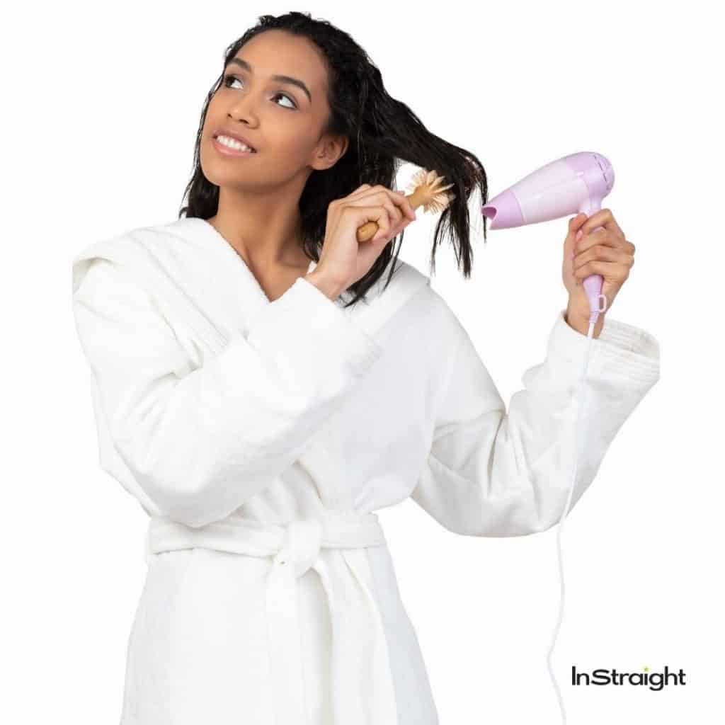 lady showing how to blow dry back of hair effortlessly